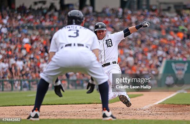 Andrew Romine of the Detroit Tigers scores on the double by Anthony Gose during the fourth inning of the game against the Houston Astros on May 24,...