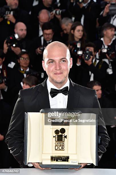 Colombian director Cesar Augusto Acevedo with the Camera d'Or for his film 'La tierra y la sombra' at closing ceremony photocall during the 68th...