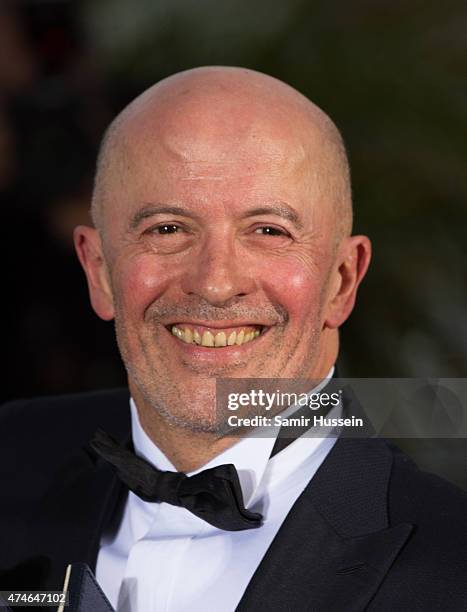 Director Jacques Audiard poses with the Palme d'Or won for 'Dheepan' attends a photocall for the winners of the Palme d'Or during the 68th annual...