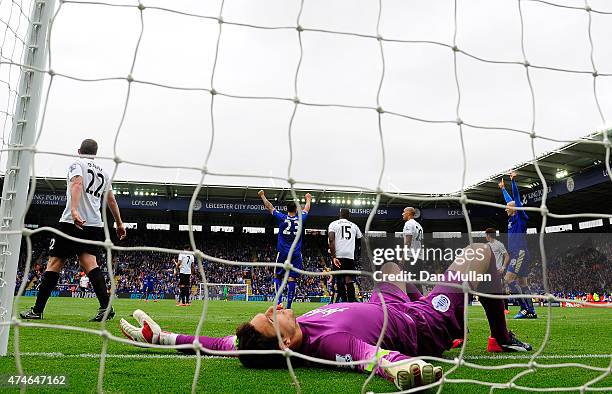 Alex McCarthy of QPR lies dejected after failing to stop a shot from Leonardo Ulloa of Leicester City during the Premier League match between...