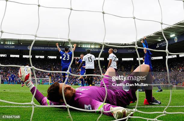 Alex McCarthy of QPR lies dejected after failing to stop a shot from Leonardo Ulloa of Leicester City during the Premier League match between...