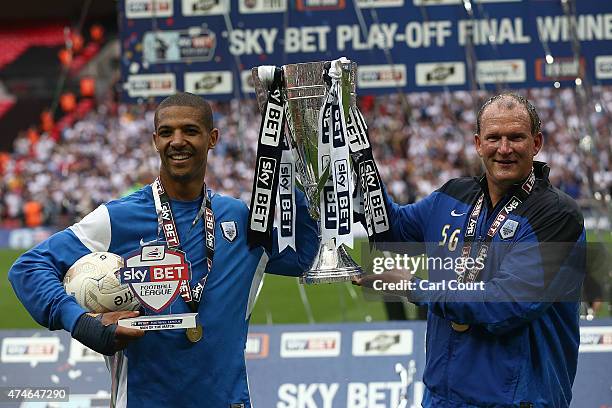 Jermaine Beckford and manager Simon Grayson of Preston North End celebrates after winning the League One play-off final between Preston North End and...