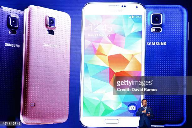 And President of Samsung JK Shin presents the new Samsung Galaxy S5 during the first day of the Mobile World Congress 2013 at Forum Complex on...