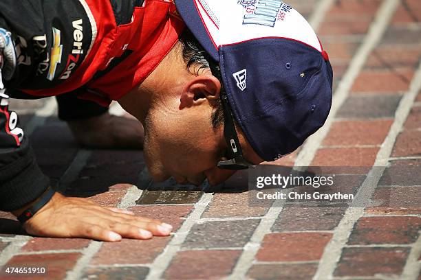 Juan Pablo Montoya of Colombia driver of the Team Penske Chevrolet Dallara celebrates after winning the 99th running of the Indianapolis 500 mile...