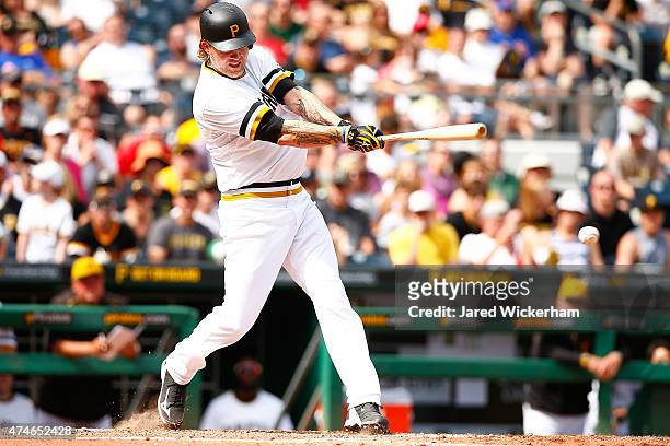 Corey Hart of the Pittsburgh Pirates hits an infield RBI single in the eighth inning against the New York Mets during the game at PNC Park on May 24,...