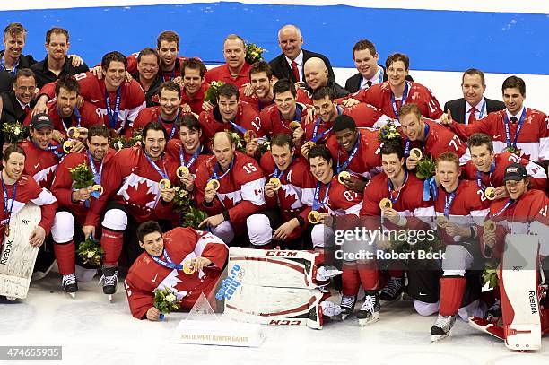 Winter Olympics: Portrait of Team Canada players victorious, posing with medals on ice after winning Men's Gold Medal Game vs Sweden at Bolshoy Ice...
