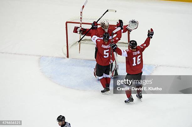 Winter Olympics: Canada Dan Hamhuis , Jonathan Toews , and goalie Carey Price victorious after winning Men's Gold Medal Game vs Sweden at Bolshoy Ice...