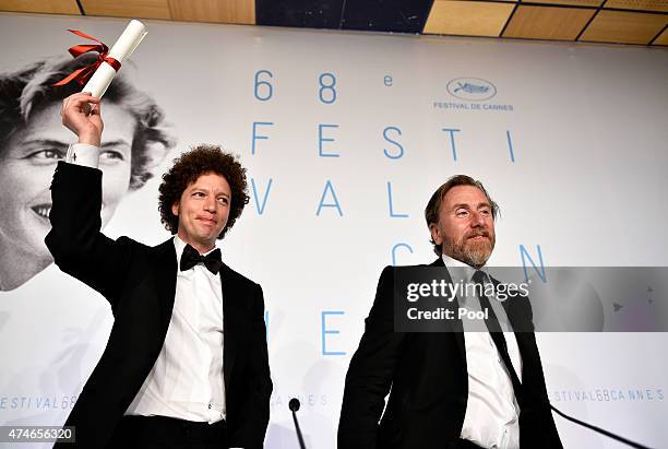 Director Michel Franco winner of the Best Screenplay Prize for his film 'Chronic' poses with actor Tim Roth during the Palme d'Or Winners press...