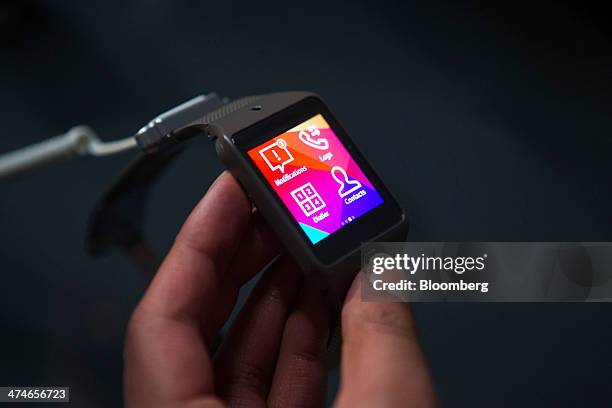 Galaxy Gear 2 wearable devices is arranged for a photograph during a Samsung Electronics Co. News conference on the opening day of the Mobile World...