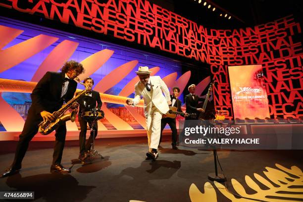 Actor John C. Reilly performs during the closing ceremony of the 68th Cannes Film Festival in Cannes, southeastern France, on May 24, 2015. AFP PHOTO...