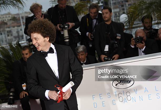 Mexican director Michel Franco smiles during a photocall after he was awarded with the Best Screenplay prize for his film "Chronic" during the...