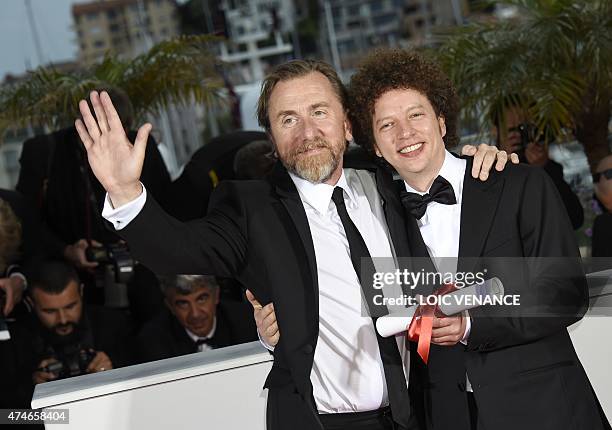 Mexican director Michel Franco poses with British actor Tim Roth during a photocall after he was awarded with the Best Screenplay prize for his film...