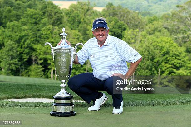 Colin Montgomerie of Scotland holds the Alfred S. Bourne Trophy after winning the Senior PGA Championship Presented By KitchenAid at the Pete Dye...