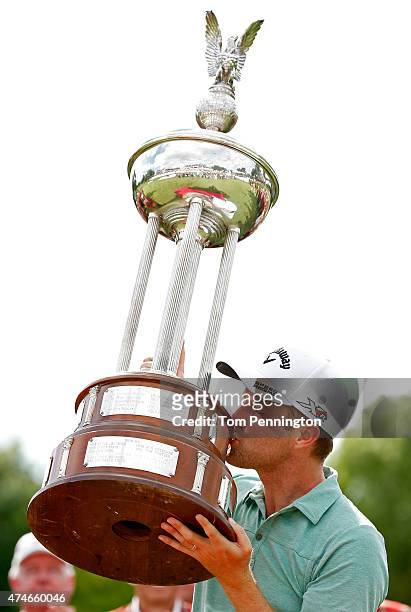 Chris Kirk kisses the Leonard trophy after winning during the final round of the Crowne Plaza Invitational at the Colonial Country Club on May 24,...