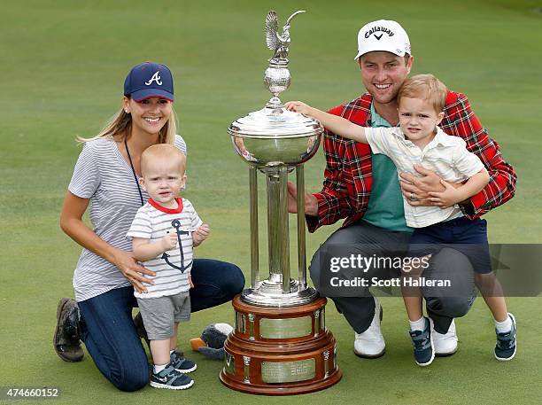 Chris Kirk, wife Tahnee and sons Foster and Sawyer Kirk pose with the Leonard trophy during the final round of the Crowne Plaza Invitational at the...