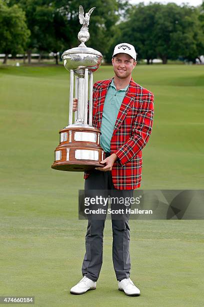 Chris Kirk poses with the Leonard trophy after winning during the final round of the Crowne Plaza Invitational at the Colonial Country Club on May...