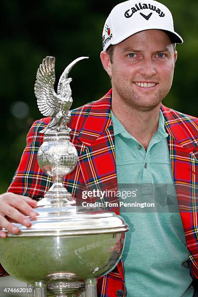 Chris Kirk poses with the Leonard trophy after winning during the final round of the Crowne Plaza Invitational at the Colonial Country Club on May...