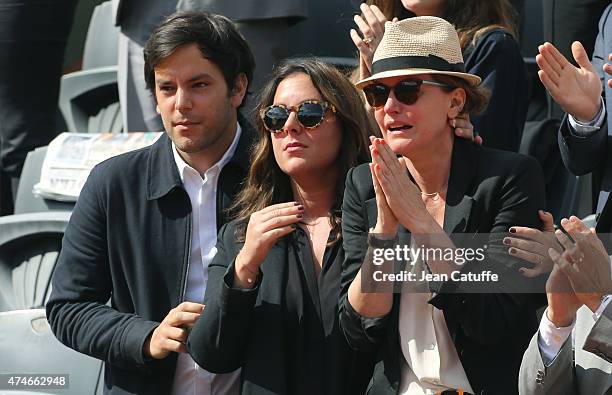 Cendrine Dominguez , her daughter Lea Dominguez and her son Leo Dominguez attend the tribute on Center Court honoring their late husband and father,...