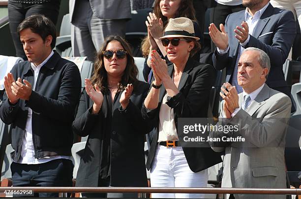 Cendrine Dominguez , her son Leo Dominguez, her daughter Lea Dominguez and President of French Tennis Federation Jean Gachassin attend the tribute on...