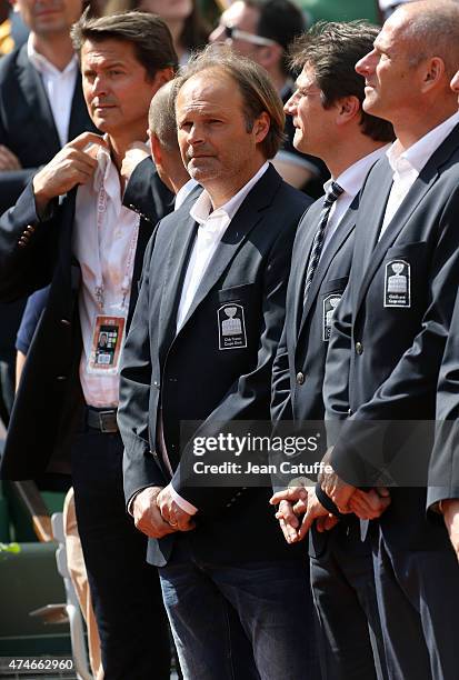 Thierry Champion and other members of the French Davis Cup Players' Club attend the tribute on Center Court honoring the late French tennis champion...
