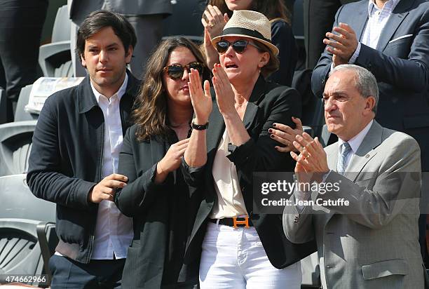 Cendrine Dominguez , her son Leo Dominguez, her daughter Lea Dominguez and President of French Tennis Federation Jean Gachassin attend the tribute on...