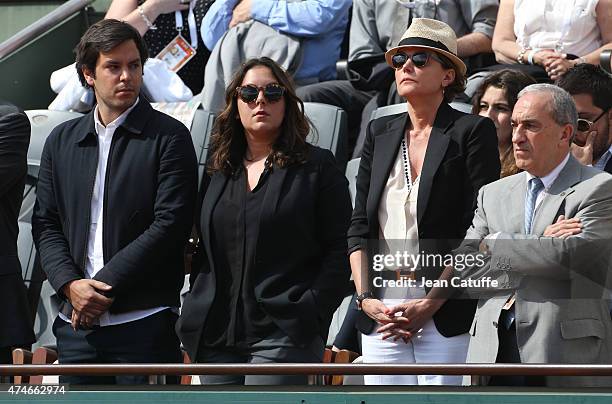 Cendrine Dominguez (C, her son Leo Dominguez, her daughter Lea Dominguez and President of French Tennis Federation Jean Gachassin attend the tribute...