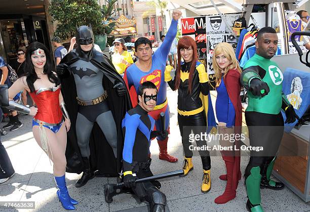 Cosplayers dressed as Wonder Woman, Batman, Superman, Batgirl, Supergirl, Green Lantern and Nightwing at Warner Bros. And DC Comics Super Hero World...