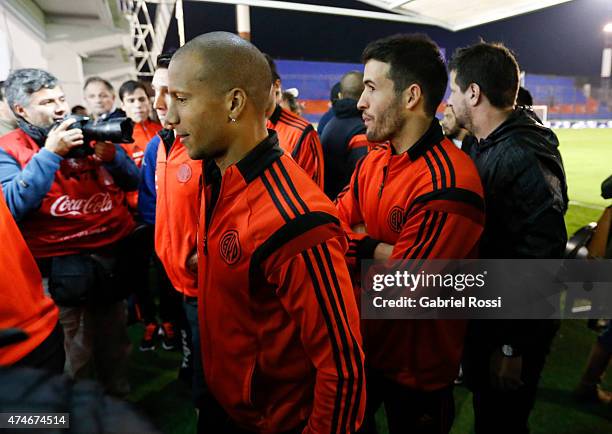 Carlos Sanchez of River Plate walks to the locker room with his teammates after receiving the confirmation of the Tigre v River Plate match...