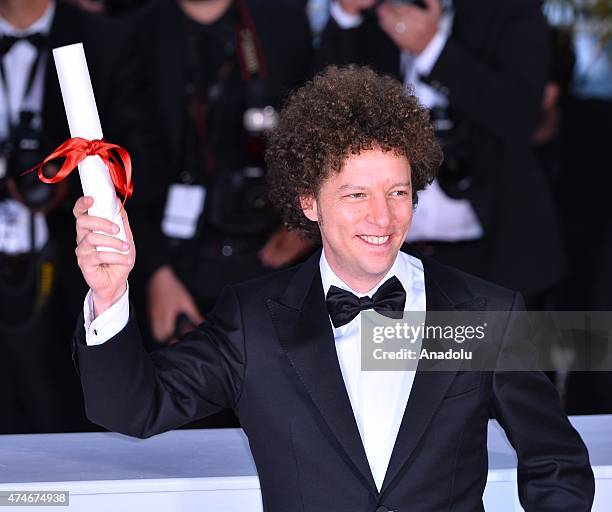 Mexican director Michel Franco poses after he received the Best Screenplay award for the film 'Chronic' during the Award Winners photocall at the...