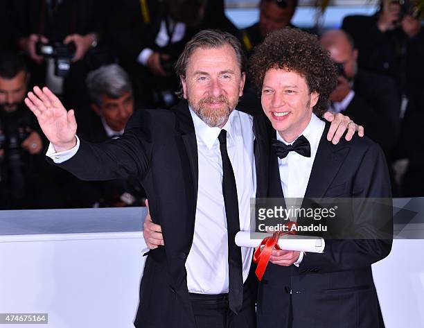 Mexican director Michel Franco poses with British actor Tim Roth after he received the Best Screenplay award for the film 'Chronic' during the Award...