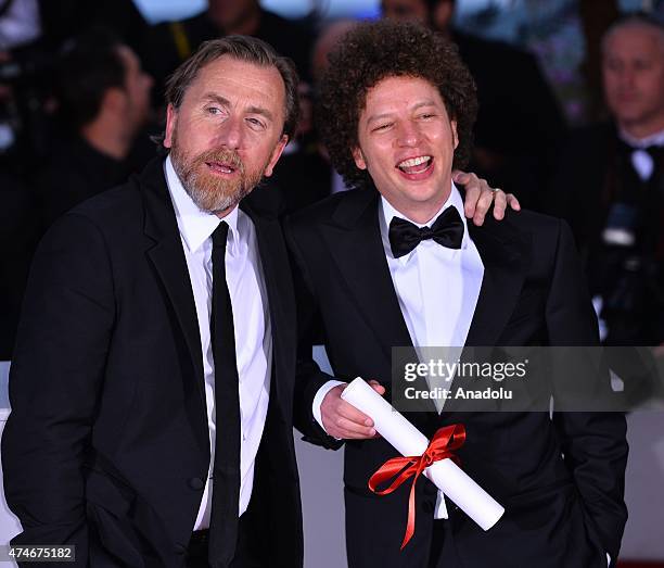 Mexican director Michel Franco poses with British actor Tim Roth after he received the Best Screenplay award for the film 'Chronic' during the Award...