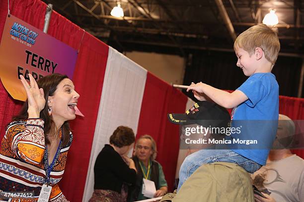 Terry Farrell, known for playing "Jadzia Dax," on Star Trek Deep Space Nine, enjoying fans, at Motor City Comic Con, at Suburban Collection Showplace...