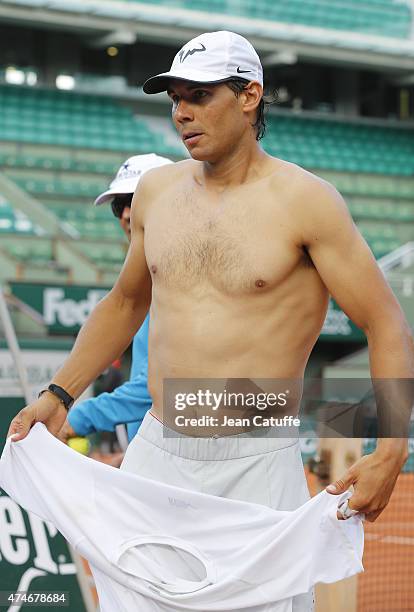 Rafael Nadal of Spain, shirtless, is practicing prior to the French Open 2015 at Roland Garros stadium on May 22, 2015 in Paris, France.