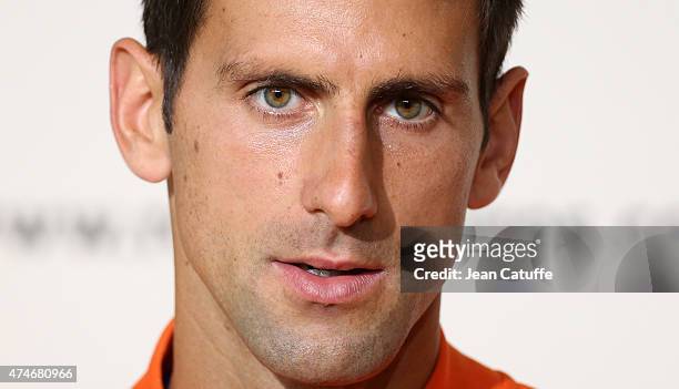 Novak Djokovic of Serbia answers to the media during a press conference prior to the French Open 2015 at Roland Garros stadium on May 22, 2015 in...