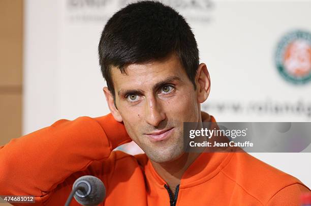 Novak Djokovic of Serbia answers to the media during a press conference prior to the French Open 2015 at Roland Garros stadium on May 22, 2015 in...