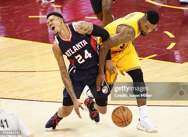 Smith of the Cleveland Cavaliers fouls Kent Bazemore of the Atlanta Hawks in the third quarter during Game Three of the Eastern Conference Finals of...