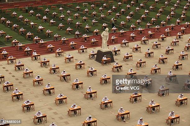 Students from College of Nursing in a vocational school take part in graduation examination outside classroom on May 25, 2015 in Baoji, Shaanxi...
