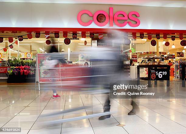 Shopper walks out of Coles supermarket on May 25, 2015 in Melbourne, Australia. In a bid to regain its title as Australia's distinguished retailer,...