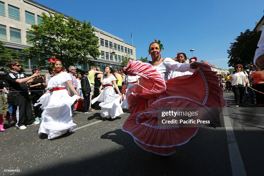 Artist with costumes at the Carnival of Cultures at...