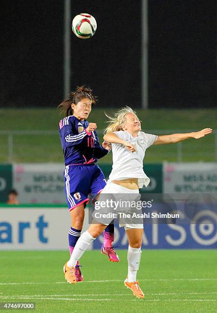 Homare Sawa of Japan and Katie Duncan of New Zealand compete for the ball during the women's soccer international friendly match between Japan and...