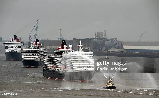 The three Cunard Queens, Queen Mary 2, Queen Victoria and Queen Elizabeth meet on the River Mersey for the first time on May 25, 2015 in Liverpool,...