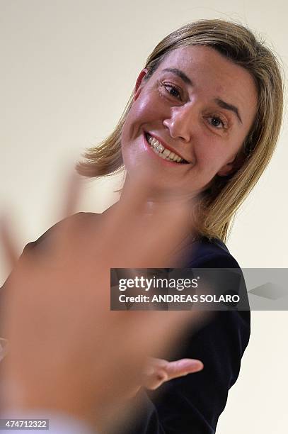 European Union Foreign Policy chief Federica Mogherini gestures after being awarded with the 2015 prize of the Institute for International Policy...