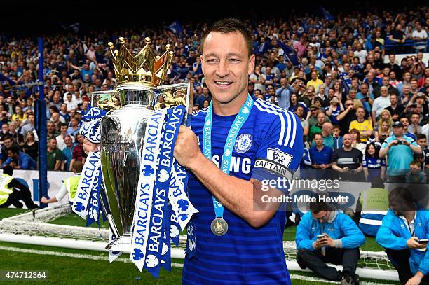 John Terry of Chelsea celebrates with the trophy after the Barclays Premier League match between Chelsea and Sunderland at Stamford Bridge on May 24,...