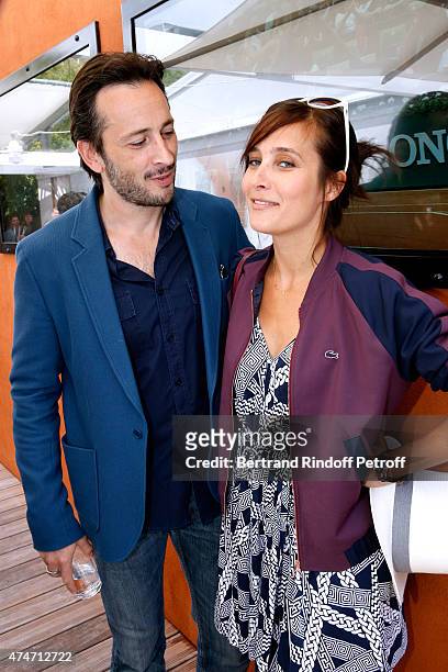 Actors Michael Cohen and Julie de Bona attend the 2015 Roland Garros French Tennis Open - Day 2, on May 25, 2015 in Paris, France.