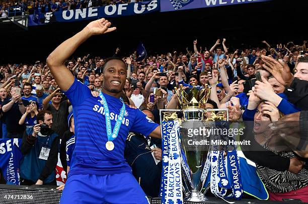 Didier Drogba of Chelsea celebrates with fans and the trophy after the Barclays Premier League match between Chelsea and Sunderland at Stamford...