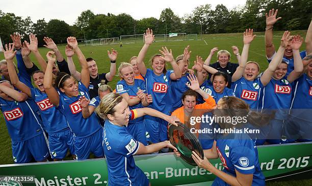 The team of Luebars celebrate with the trophy after winning the Women's Second Bundesliga match between FFV Leipzig and 1.FC Luebars at Sportschule...