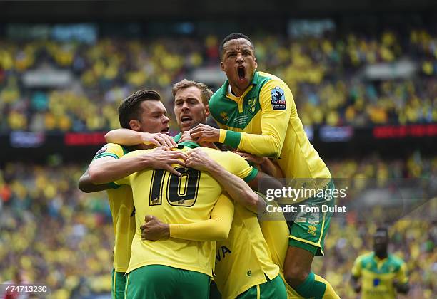 Cameron Jerome of Norwich City is congratulated by Martin Olsson and team mates as he scores their first goal during the Sky Bet Championship Playoff...