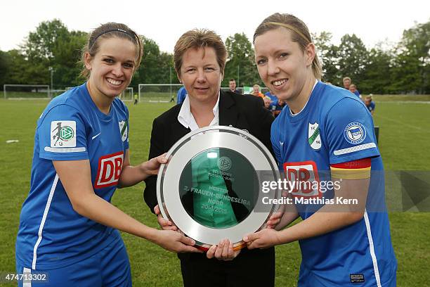 Anne Schaefer, Elfie Wutke and Zsofia Racz pose with the trophy after the team of Luebars winning the Women's Second Bundesliga match between FFV...