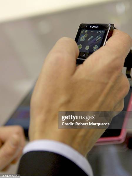 Congress attendee examines the latest Sony Mobile wearable during Mobile World Congress 2014 on February 24, 2014 in Barcelona, Spain. The Mobile...