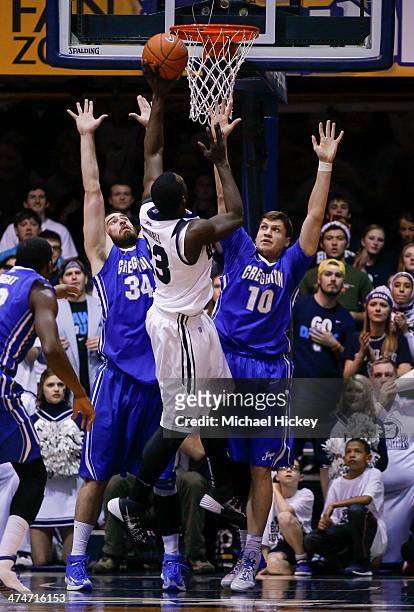 Khyle Marshall of the Butler Bulldogs shoots the ball against Ethan Wragge and Grant Gibbs of the Creighton Bluejays at Hinkle Fieldhouse on February...